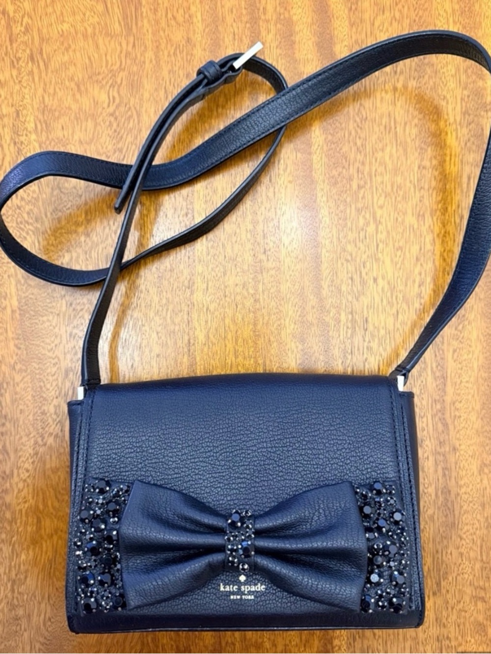 kate spade black leather bow crossbody with crystal accents